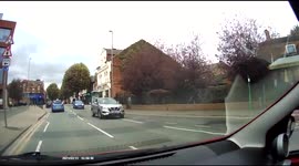 Woman with child walks into road with child