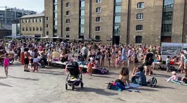 Crowds cool down at the fountains in Granary Square in King’s Cross as temperatures soar