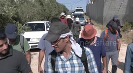Israeli forces prevent a protest against increasing Jewish settlements