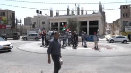 Palestinians confront Israeli security forces during a flag march