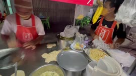 Street food vendor makes awesome roti snacks in southern Thailand