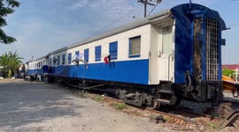 Train carriage converted into sleeping quarters for railway workers in Thailand