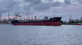 Cargo ship sails along Chao Phraya River in Bangkok, Thailand