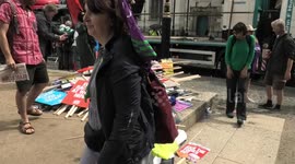 Placards piled high on Parliament Square after the end of the TUC 'Cost of living; march in London.