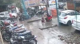 Indian couple on scooter rescued in extremis after falling into ravine covered with rain water