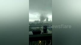 Sparks fly into sky as tornado tears through Chinese city