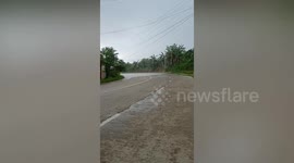 Rain storm bizarrely covers only part of road due to rare weather phenomenon