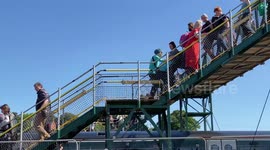 Hundreds of Glastonbury Festival-goers arrive a day early at Castle Carey train station