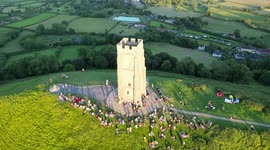 Drone footage of the pre-Summer Solstice sunset celebrated at the Glastonbury Tor