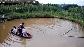 Frightened child in hysterics after large fish leaps into boat in China