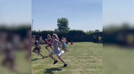 Hilarious moment mum faceplants and moons crowd during parents' race