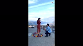 US man proposes to high-school girlfriend in front of serene backdrop