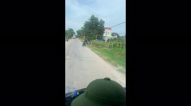 Man moves wheelchair at high speed on the highway in Vietnam