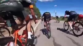 Foul play! Cyclist ELBOWS rival sending him crashing into ground just yards from finish line