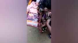 Brave woman fights off killer crocodile pulling her underwater in Indonesia