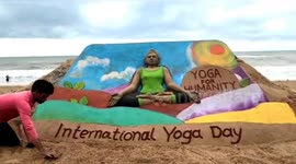 Indian sand artist creates different yoga sculptures for International Yoga Day
