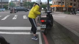 WTF Moment: Moped rider called out for trying to hide her license plate! (Dashcam Video)