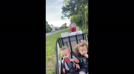 Cute kids attempt to eat popsicles on a bike ride