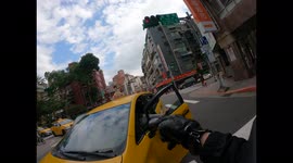 WTF Moment: Taxi driver crashes into moped rider while waiting at traffic lights (Dashcam Video)
