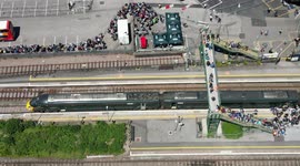 Drone footage captures huge operation underway as thousands of Glastonbury Festival-goers arrive at Castle Cary station