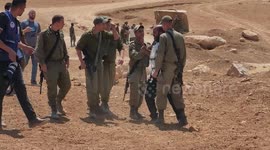 Israeli soldiers clash with Palestinian activists during a protest against the Israeli military drill