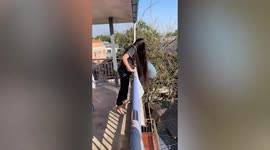 Real-life 'Rapunzel' swings her hair from balcony in Myanmar