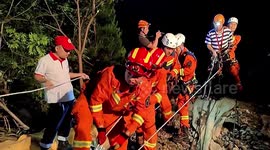 Rescuers save 2 men trapped on 100-metre-high cliff in China