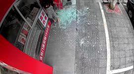 Glass door shatters after shop owner pushes it open in China