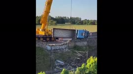 Lorry crashes through wall, onto train tracks near Edinburgh, Scotland