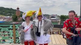 Two women dress as seagulls at Glastonbury Festival in UK