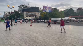 Locals play keepy-uppy with 'jianzi' football shuttlecock in Cambodia