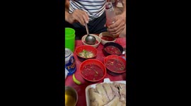 A restaurant owner directly makes dishes from raw blood from ducks for customers to enjoy at the dining table