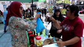 Palestinians attend the farmers market in the West Bank city of Ramallah
