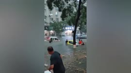 Vehicles stranded as floodwater submerges streets in eastern China