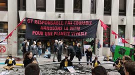 Extinction Rebellion activists stick themselves together outside International Monetary Fund in Paris