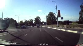 The car skidded on the turn due to speeding and collided with oncoming traffic