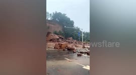 Mud splatters onto car front windscreen as mountainside collapses in China