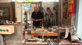 Palestinian architect Mohammad Helles, works in wood products in his workshop