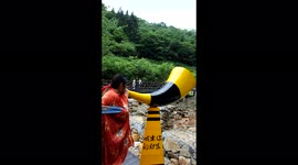 Tourists Experience Shouting Fountain In Yichang, China