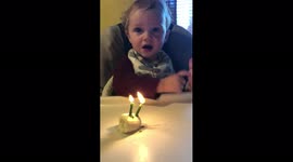 Boy Tries to Blow Out Candles
