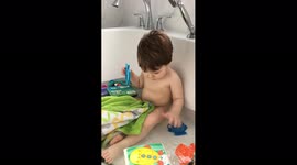 Boy Looks at Groin in Bathc