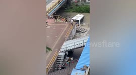 Bus slides into river after driver faints in Shanghai