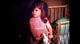 Girl Plays On Toy Horse