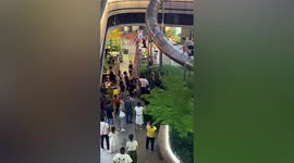 Man rescues 3-year-old who climbed up spiral slide at mall in China