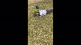 Boy Rolls While Dog Poops