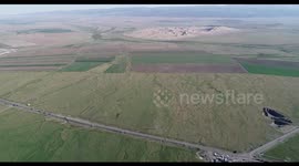 Mingsha Mountain Surrounded By Grassland And River in Hami, China