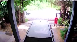 Child pinned to the ground by falling iron gate on parent's driveway