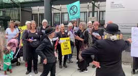 Extinction Rebellion sing ‘ Money, Money, Money is so funny in Shell and BP’s World’ outside government building