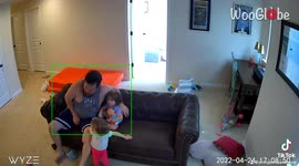 Dad collapses to floor in pain after daughter accidentally knees him between legs