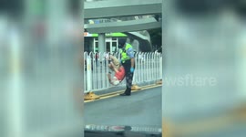 Police officer helps man who got leg trapped in central reservation barrier